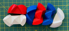 Puzzle esférico 3D NCK mini de 5 cm en blanco + rojo + azul, con las piezas sueltas