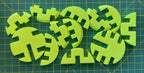 Puzzle esférico 3D ORT mini de 5 cm en amarillo flúor, con las piezas sueltas