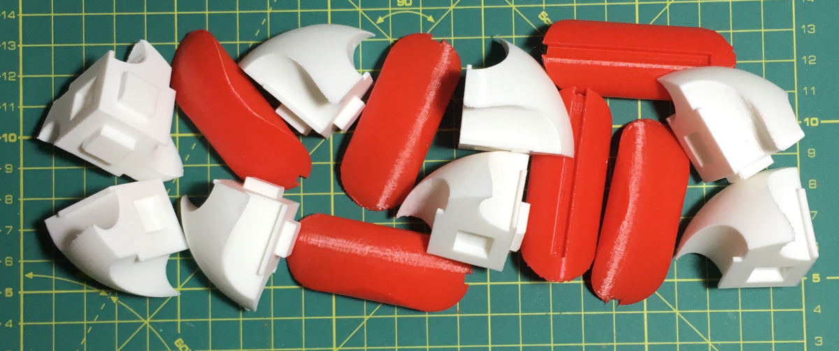 Puzzle esférico 3D TMG de 7,5 cm en blanco + rojo, con las piezas sueltas